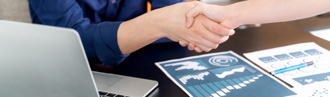 Selective focus young man handshake with someone at office